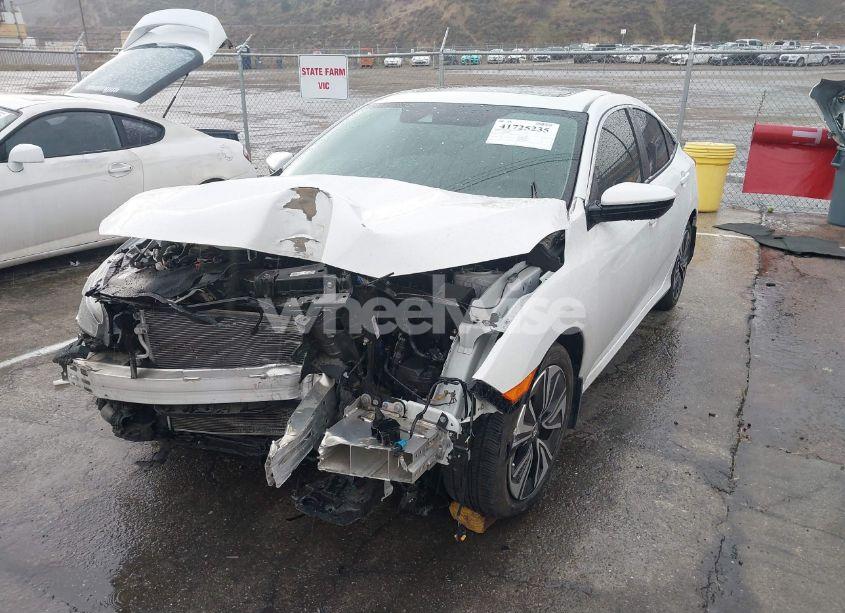 Photo 2 of 2020 Honda Civic EX-L (VIN 19XFC1F7XLE208720)