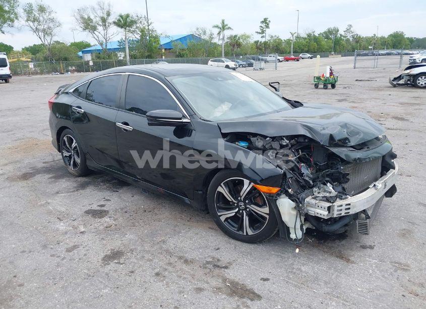2016 Honda Civic TOURING (VIN 19XFC1F92GE007692) main photo