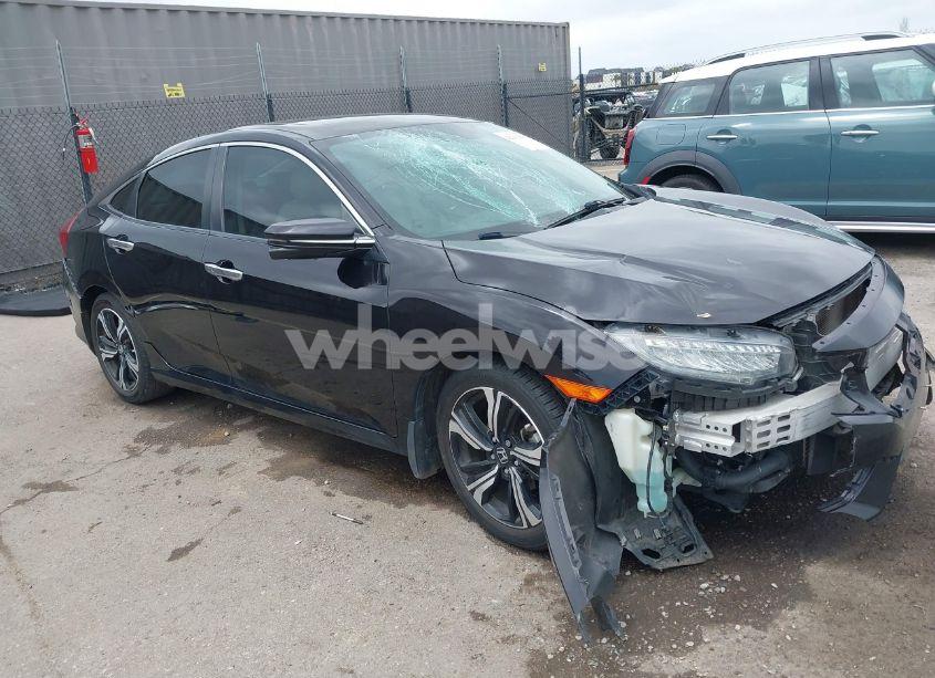 2017 Honda Civic TOURING (VIN 19XFC1F97HE011349) main photo