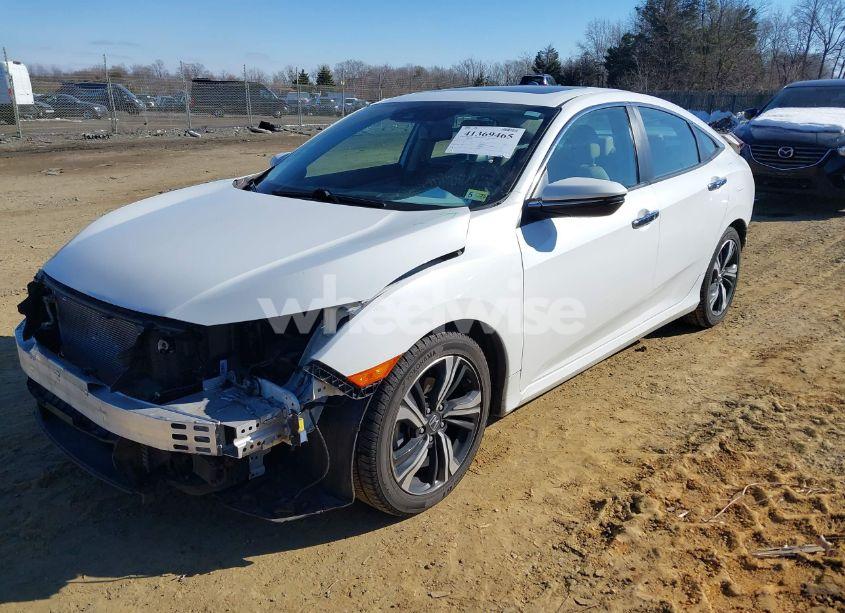 Photo 2 of 2017 Honda Civic TOURING (VIN 19XFC1F97HE015398)