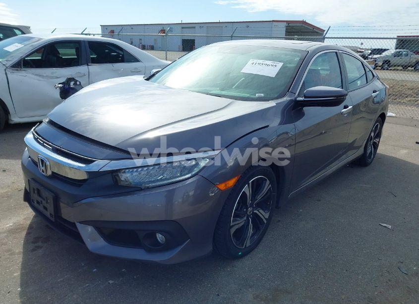 Photo 2 of 2017 Honda Civic TOURING (VIN 19XFC1F99HE007058)