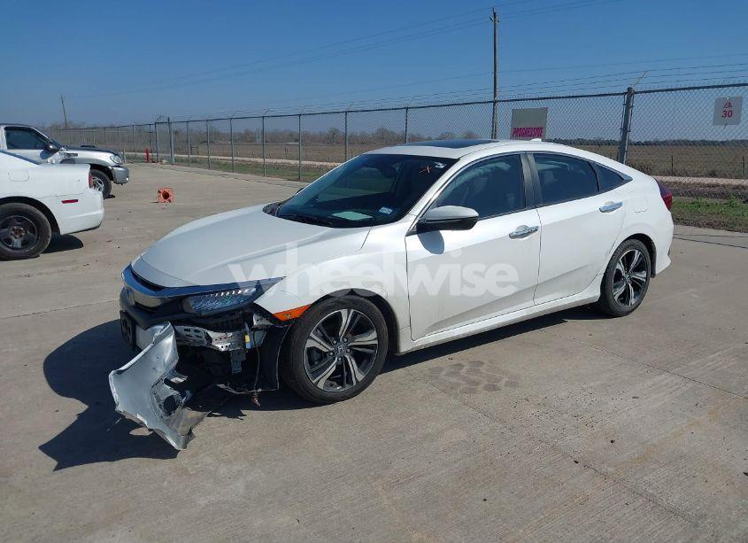 Photo 2 of 2017 Honda Civic TOURING (VIN 19XFC1F99HE030484)