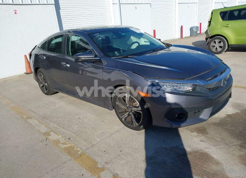 2016 Honda Civic TOURING (VIN 19XFC1F9XGE210457) main photo