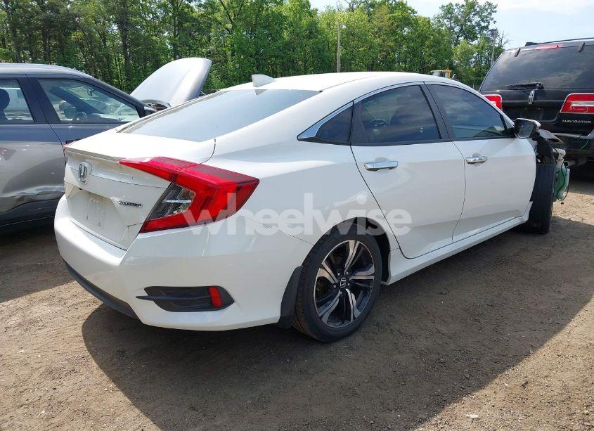Photo 4 of 2017 Honda Civic TOURING (VIN 19XFC1F9XHE032566)