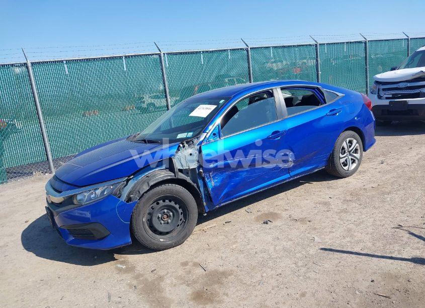 Photo 2 of 2018 Honda Civic LX (VIN 19XFC2E51JE000549)