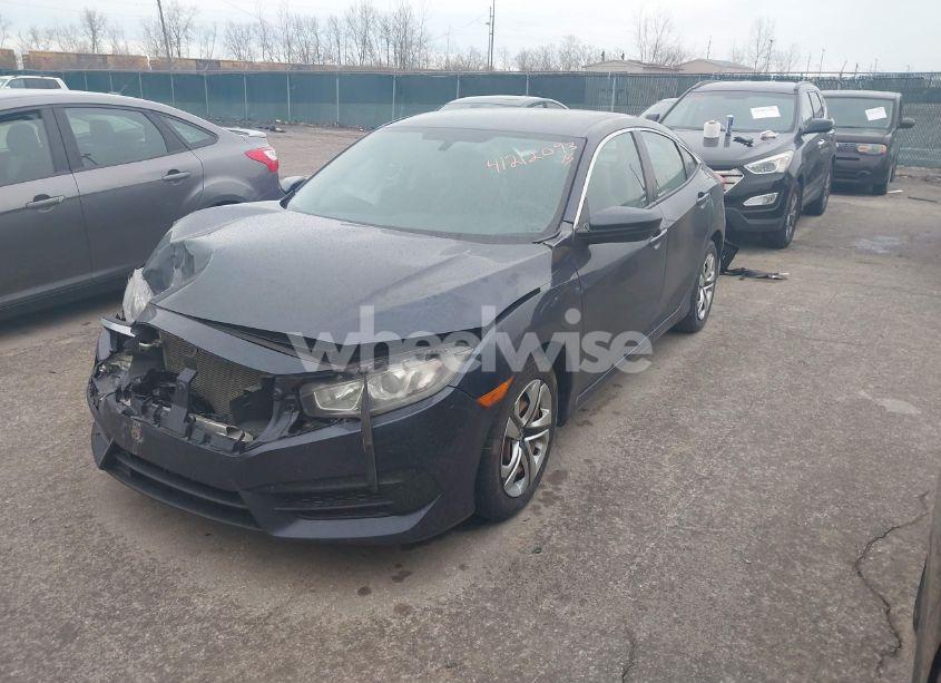 Photo 2 of 2018 Honda Civic LX (VIN 19XFC2F50JE009340)
