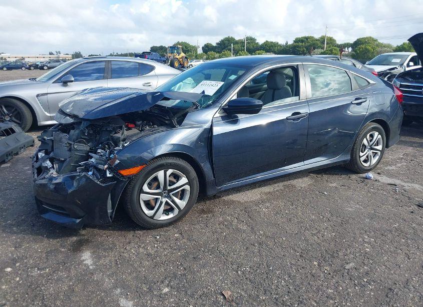 Photo 2 of 2018 Honda Civic LX (VIN 19XFC2F50JE040183)