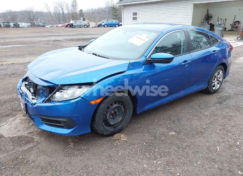 Photo 2 of 2017 Honda Civic LX (VIN 19XFC2F51HE075311)