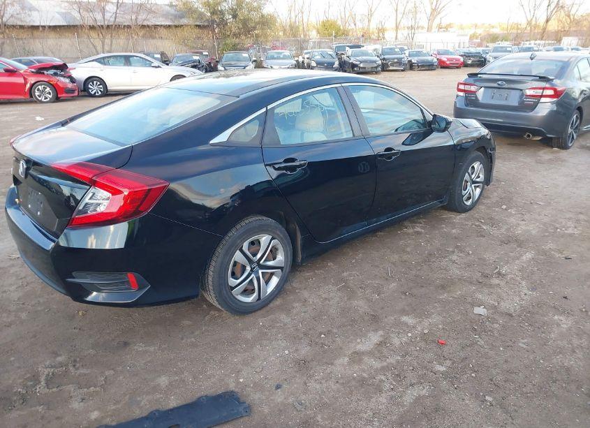 Photo 4 of 2018 Honda Civic LX (VIN 19XFC2F51JE021092)
