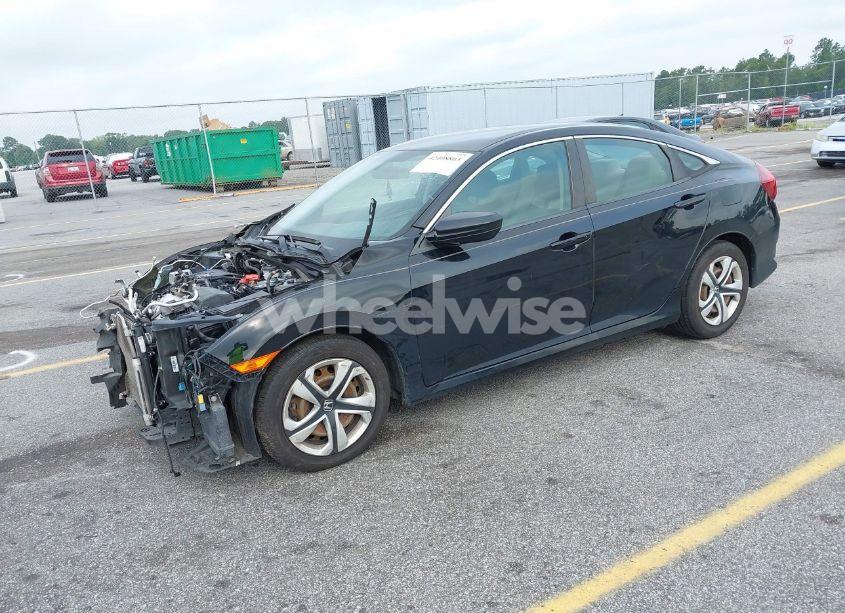 Photo 2 of 2018 Honda Civic LX (VIN 19XFC2F51JE040256)