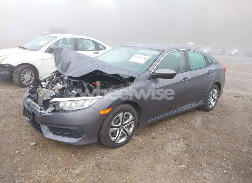 Photo 2 of 2018 Honda Civic LX (VIN 19XFC2F51JE200782)