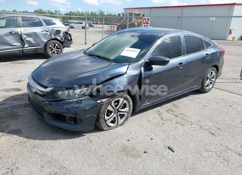 Photo 2 of 2018 Honda Civic LX (VIN 19XFC2F52JE014944)
