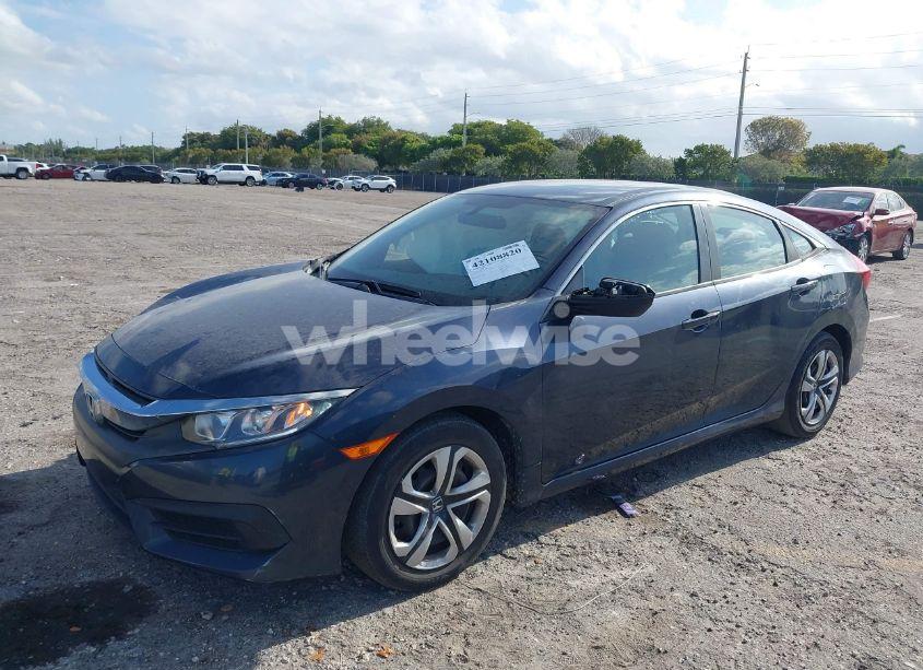 Photo 2 of 2018 Honda Civic LX (VIN 19XFC2F52JE018654)