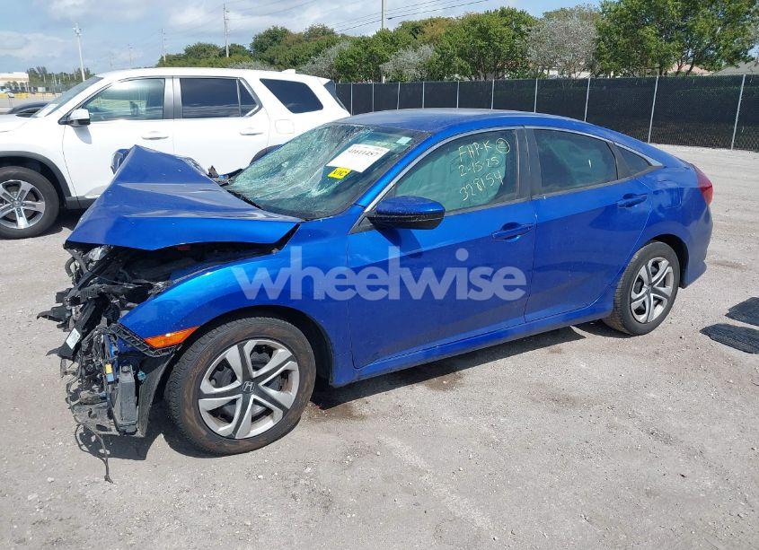 Photo 2 of 2018 Honda Civic LX (VIN 19XFC2F52JE043148)