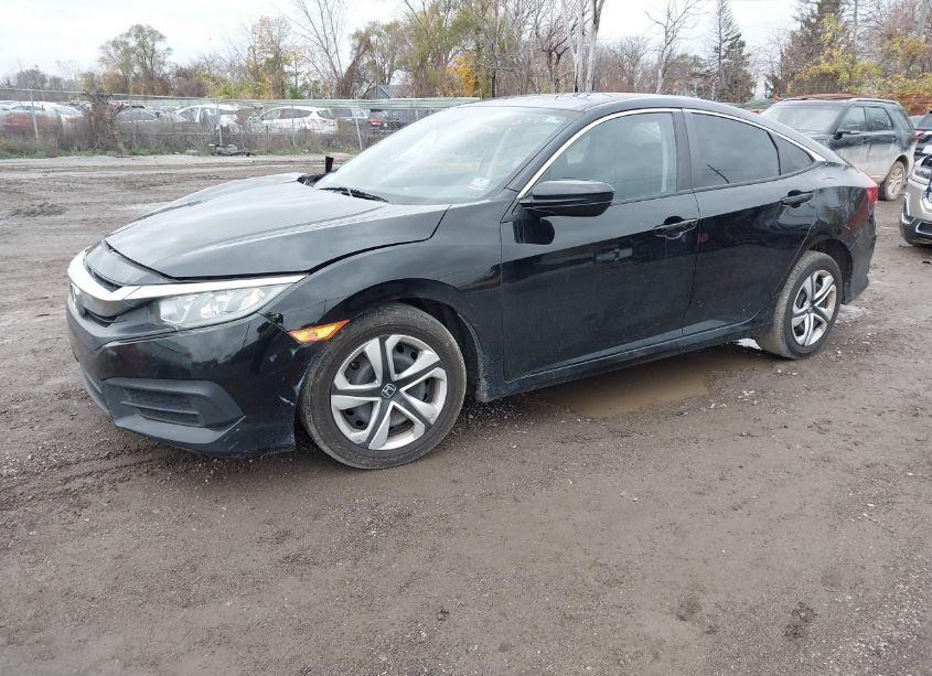 Photo 2 of 2018 Honda Civic LX (VIN 19XFC2F52JE043490)