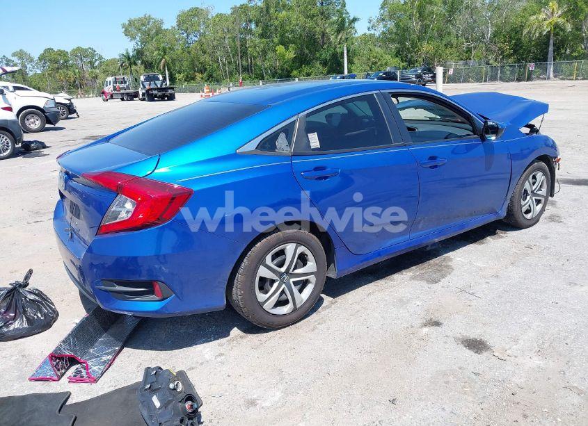 Photo 4 of 2018 Honda Civic LX (VIN 19XFC2F54JE027744)