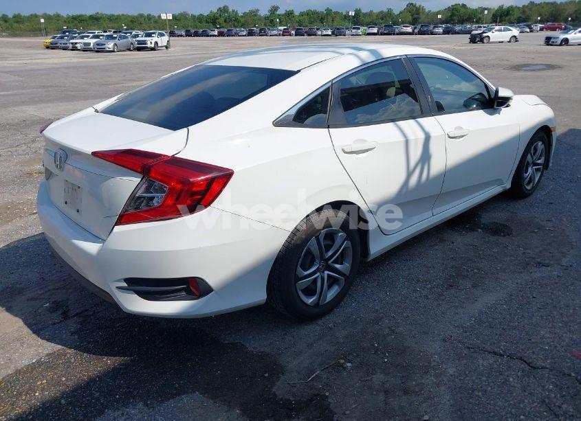 Photo 4 of 2017 Honda Civic LX (VIN 19XFC2F56HE015329)