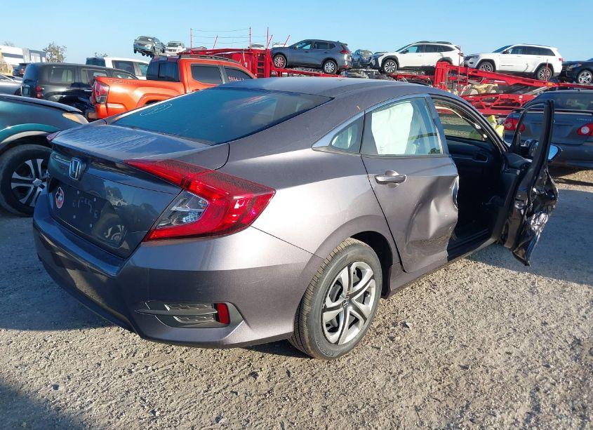 Photo 4 of 2018 Honda Civic LX (VIN 19XFC2F56JE005390)