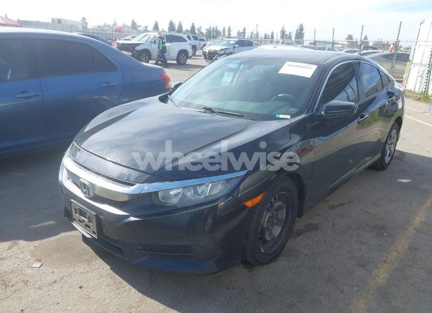 Photo 2 of 2018 Honda Civic LX (VIN 19XFC2F57JE200351)