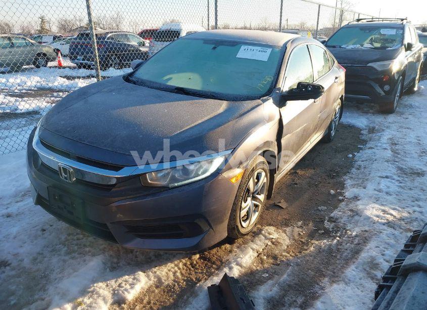 Photo 2 of 2017 Honda Civic LX (VIN 19XFC2F5XHE011249)