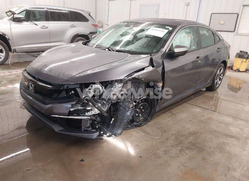 Photo 2 of 2021 Honda Civic LX (VIN 19XFC2F61ME001485)