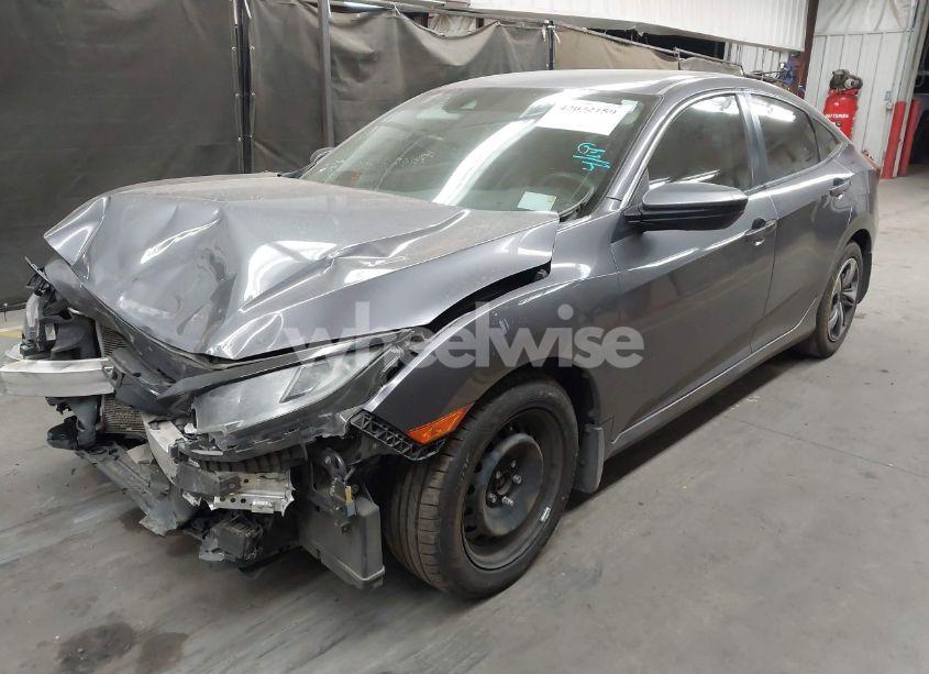 Photo 2 of 2020 Honda Civic LX (VIN 19XFC2F67LE006057)