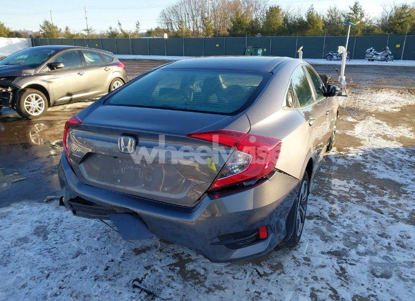 Photo 4 of 2021 Honda Civic LX (VIN 19XFC2F69ME001623)