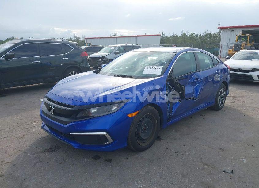 Photo 2 of 2019 Honda Civic LX (VIN 19XFC2F6XKE047765)