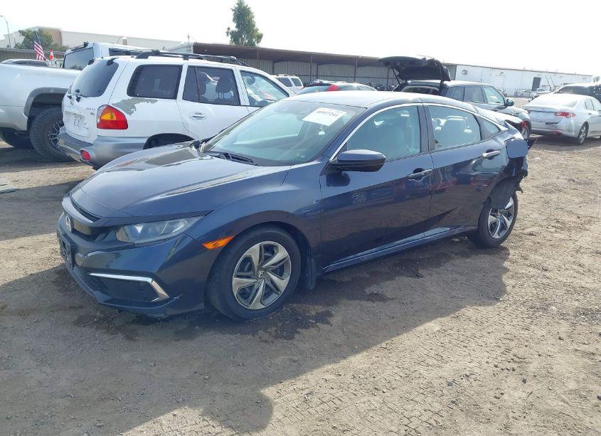 Photo 2 of 2019 Honda Civic LX (VIN 19XFC2F6XKE203819)