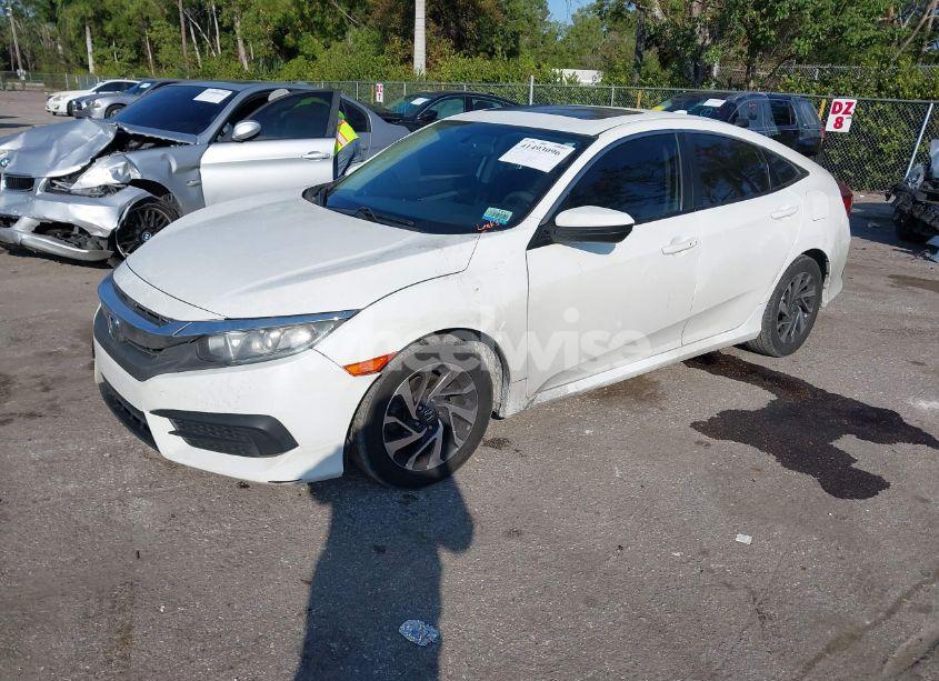 Photo 2 of 2018 Honda Civic EX (VIN 19XFC2F79JE032472)