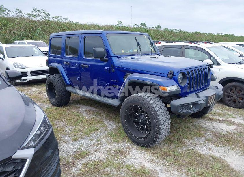 2019 Jeep Wrangler UNLIMITED SAHARA 4X4 (VIN 1C4HJXEG7KW633349) main photo
