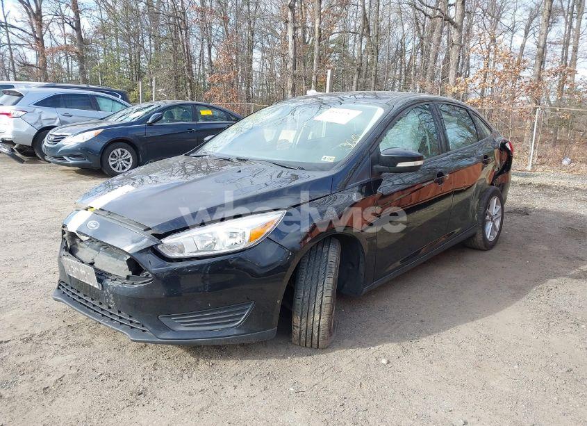 Photo 2 of 2017 Ford Focus SE (VIN 1FADP3F2XHL321700)