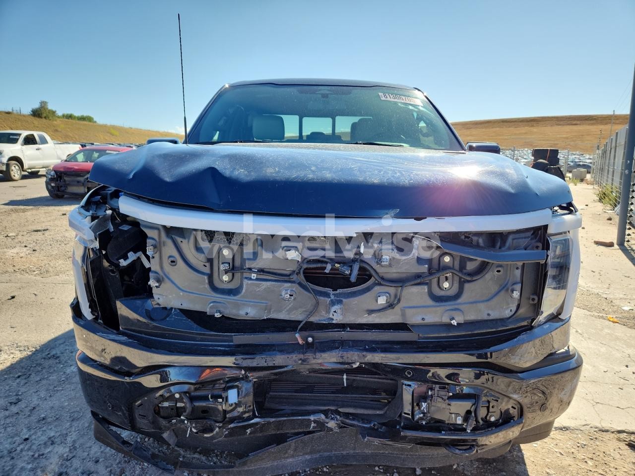 Photo 5 of 2024 FORD F150 LIGHTNING PLATINUM (VIN 1FT6W7L74RWG00105)