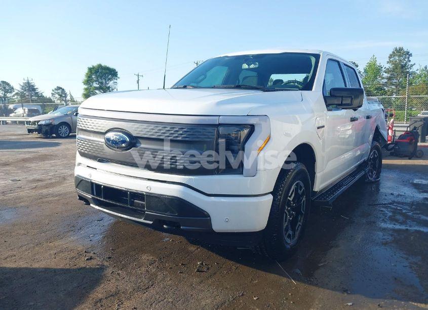 Photo 2 of 2023 Ford F-150 LIGHTNING XLT (VIN 1FTVW1EL6PWG34059)