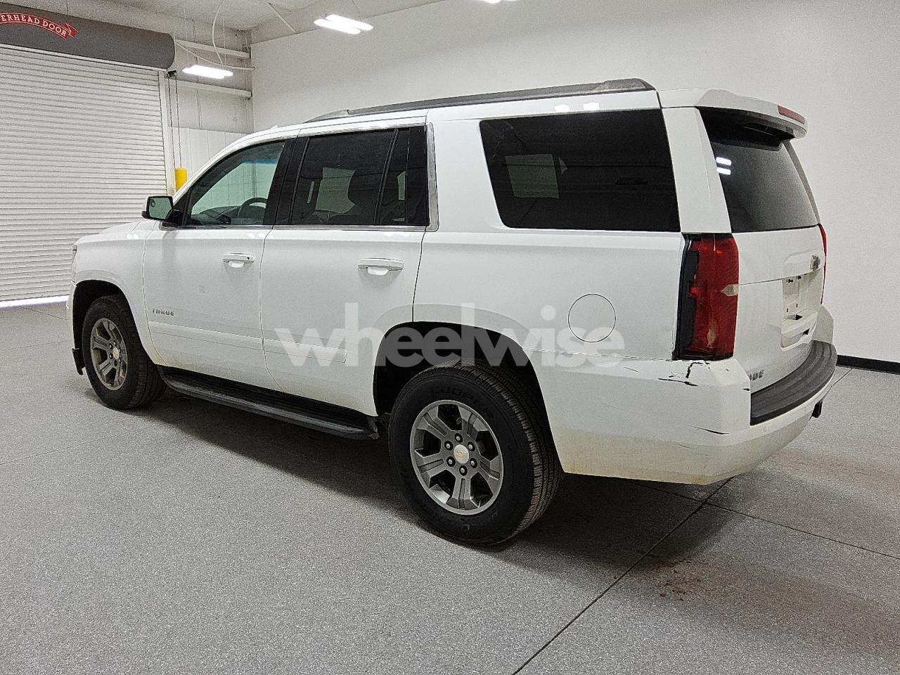 Photo 2 of 2019 CHEVROLET TAHOE C1500 LS (VIN 1GNSCAKC7KR212591)