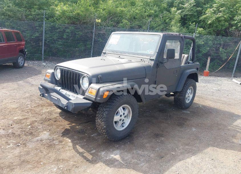 Photo 2 of 1999 Jeep Wrangler SE (VIN 1J4FY29P3XP469786)