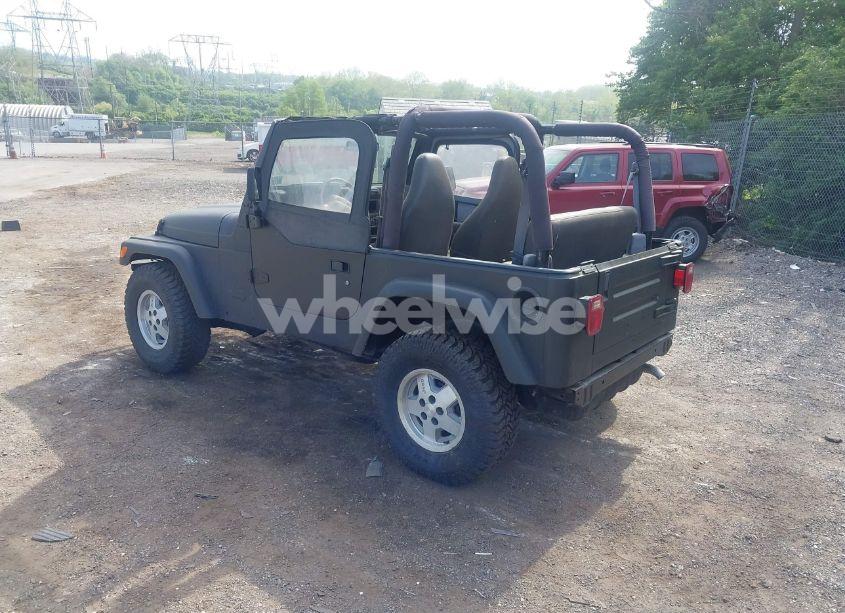 Photo 3 of 1999 Jeep Wrangler SE (VIN 1J4FY29P3XP469786)