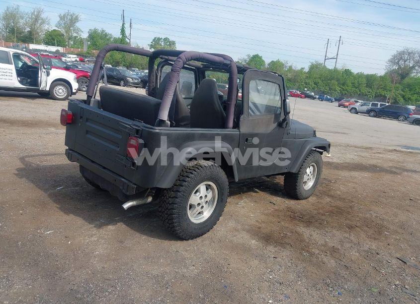 Photo 4 of 1999 Jeep Wrangler SE (VIN 1J4FY29P3XP469786)