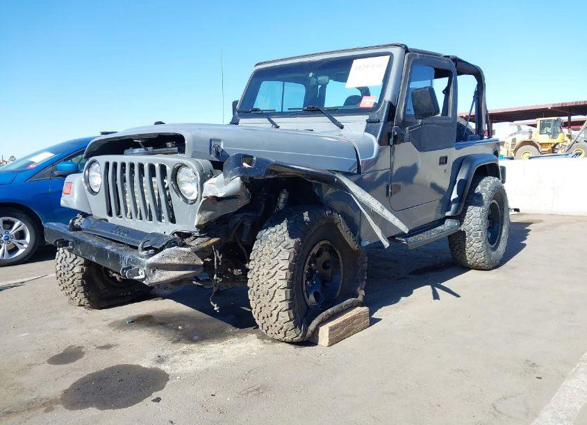 Photo 2 of 1999 Jeep Wrangler SE (VIN 1J4FY29P9XP479416)
