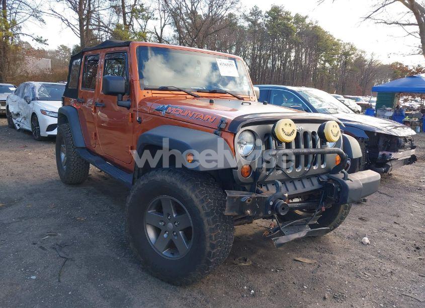 2010 Jeep Wrangler UNLIMITED MOUNTAIN (VIN 1J4HA3H15AL192329) main photo