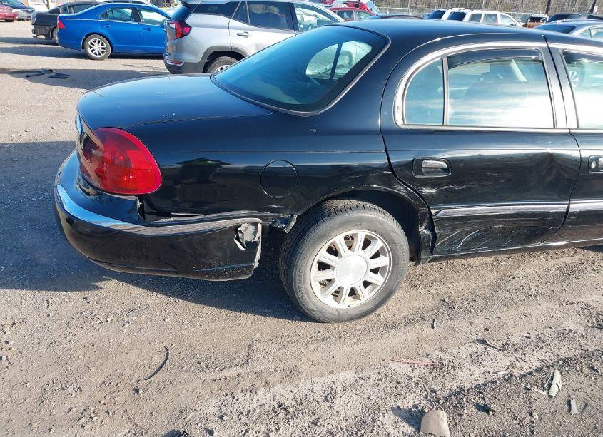 Photo 6 of 2000 Lincoln Continental (VIN 1LNHM97V1YY844621)