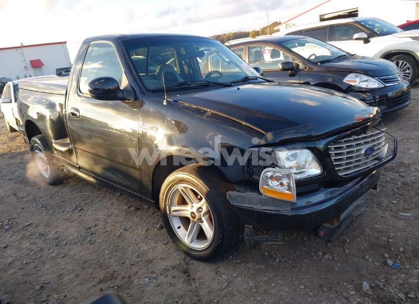 2004 Ford F-150 HERITAGE LIGHTNING (VIN 2FTRF07334CA19761) main photo