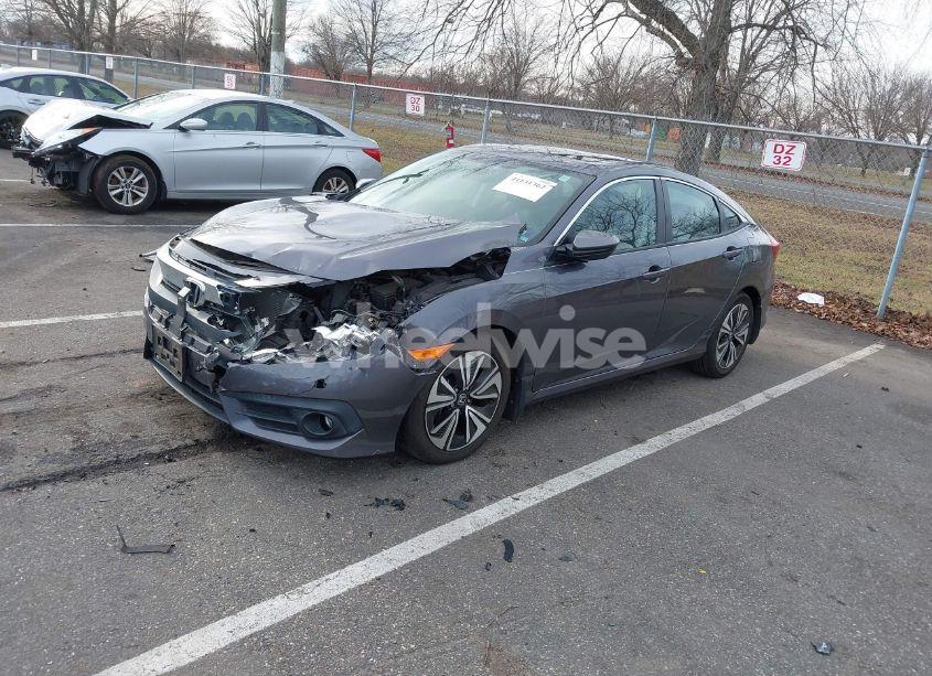 Photo 2 of 2017 Honda Civic EX-L (VIN 2HGFC1F7XHH657697)