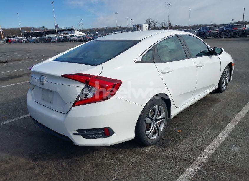 Photo 4 of 2018 Honda Civic LX (VIN 2HGFC2F51JH509609)