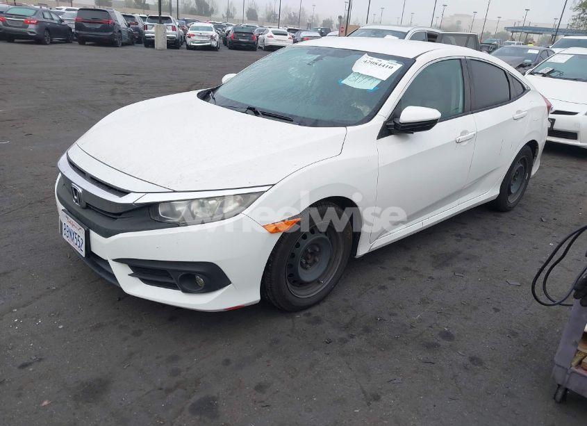 Photo 2 of 2018 Honda Civic LX (VIN 2HGFC2F57JH502776)