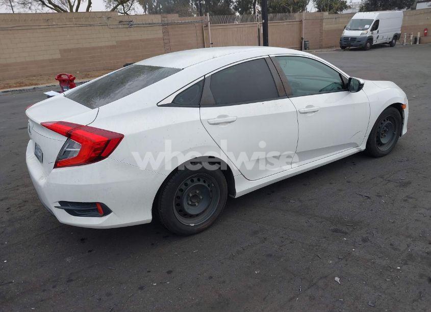 Photo 4 of 2018 Honda Civic LX (VIN 2HGFC2F57JH502776)