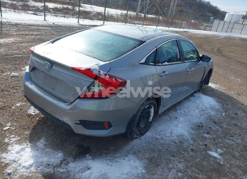 Photo 4 of 2018 Honda Civic LX (VIN 2HGFC2F57JH571628)