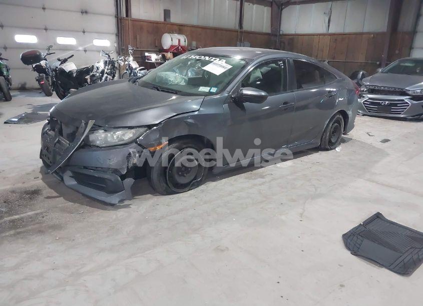 Photo 2 of 2018 Honda Civic LX (VIN 2HGFC2F5XJH520527)
