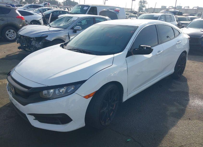 Photo 2 of 2018 Honda Civic LX (VIN 2HGFC2F5XJH555911)