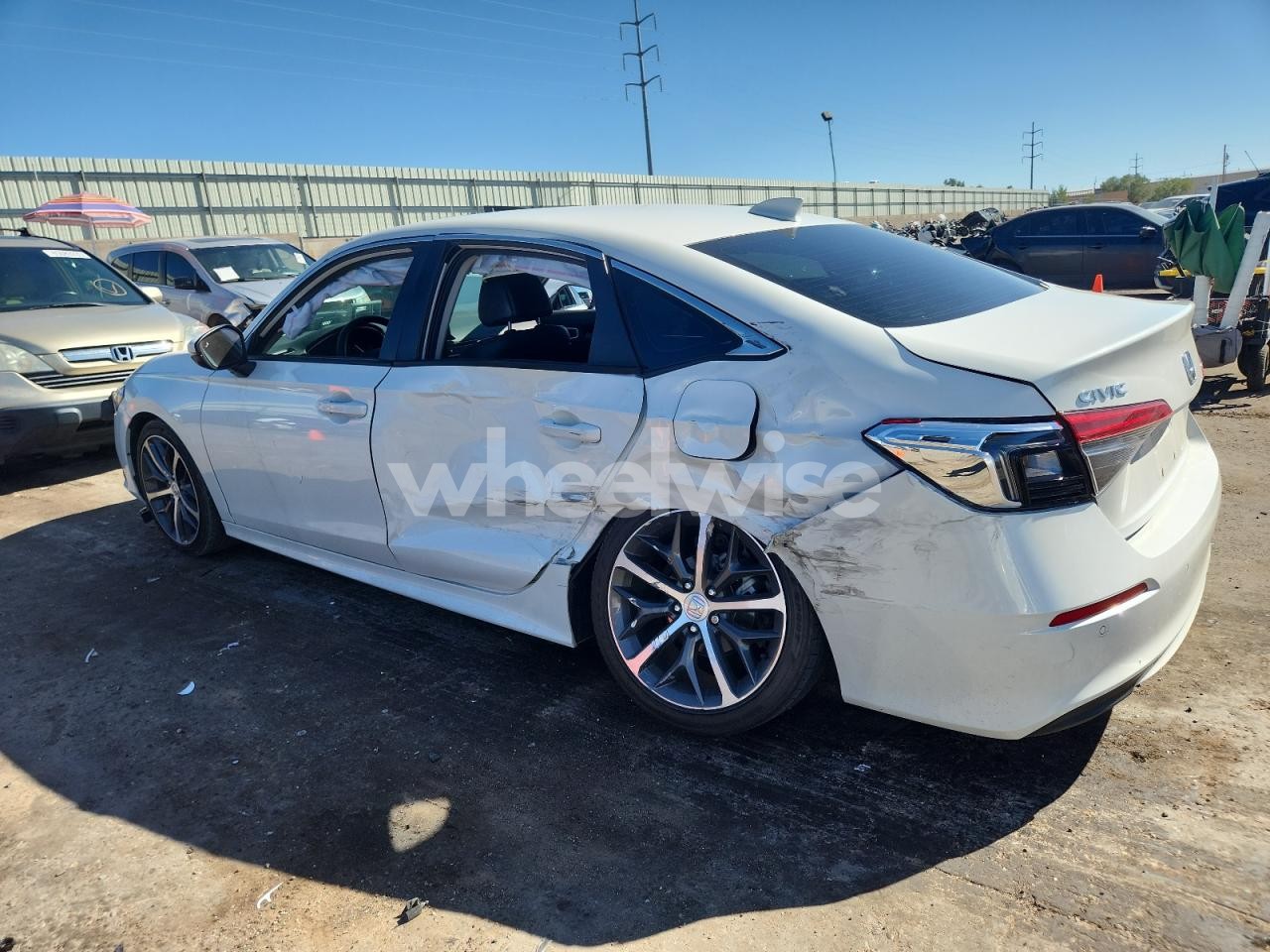 Photo 2 of 2024 HONDA CIVIC TOURING (VIN 2HGFE1F95RH300425)